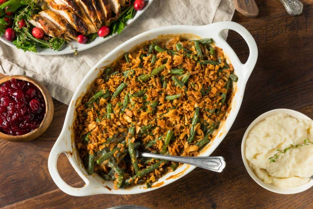 Golden-brown green bean casserole topped with crispy fried onions