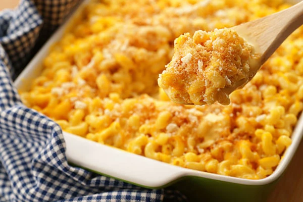 A bowl of baked mac and cheese with a golden brown crust.