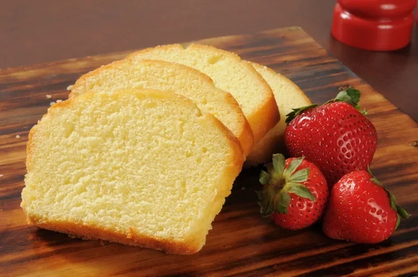 A freshly sliced pound cake with strawberries>
<p>Great Granny's Pound Cake is an old-fashioned dessert that stands the test of time. Already a classic in her day, this recipe turns out a soft cakey interior that is moist and rich, with an even crumb. Enjoy a slice on the back porch with a cup of coffee after dinner like in the good old days.</p>
<p>While great in its traditional form, it gets even better! Dress up your Pound Cake with fresh fruit and whipped cream for a knock-out strawberry shortcake. It’s the perfect addition to a summer picnic or a lazy day in the backyard with friends.</p>

<HR COLOR=
